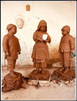 三個(gè)小孩雕塑